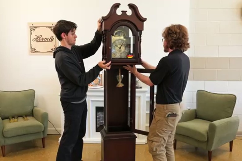 Setting a grandfather clock in its new spot